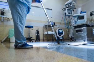 photo of A hospital worker doing cleaning in operation room
