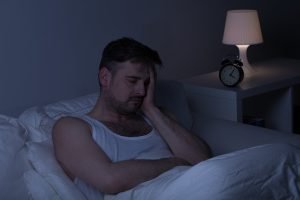 Tired man with insomnia needs some sleep