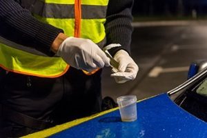 Laborer administering drug test