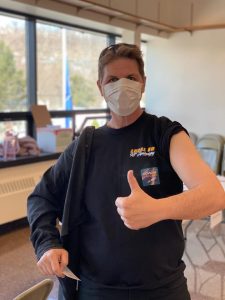 Laborers Local 60 member with a thumb up after receiveing COVID 19 vaccine
