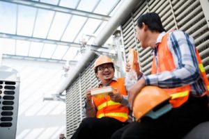 construction workers smiling eating lunch