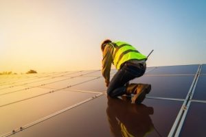 construction worker on solar panel